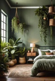 a bedroom with green walls and plants hanging from the ceiling, along with a bed