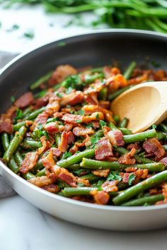 a pan filled with green beans and bacon