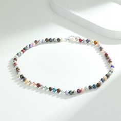 Add a splash of color to your day with our Adjustable Multicolored Pearl Necklace. This piece features nearly round pearls in a spectrum of colors, strung together with an adjustable extension chain. It's a versatile and vibrant accessory that can adapt to any neckline or outfit. Length: 18" inches with an extension chain of 2" inches, perfect for women. (45cm - 51cm) Product Information Pearl Type Freshwater Origin China Shape Nearly Round Quality AA+ Size 6-7mm Nacre Very Thick Color Colored M Multicolor Round Beads Pearl Necklace, Multicolor Beaded Necklace With Pearl Charm, Rainbow Pearl Necklace With Round Beads, Multicolor Pearl Charm Necklace, Multicolor Pearl Charm Necklaces, Multicolor Pearl Necklaces With Pearl Charm, Rainbow Round Beads Pearl Necklace, Multicolor Necklace With Pearl Chain And Round Beads, Elegant Multicolor Beaded Necklaces With Pearl Charm