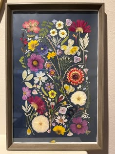 an art piece with flowers painted on it