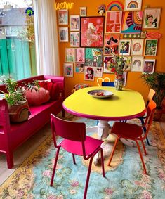 a brightly colored room with colorful furniture and pictures on the wall