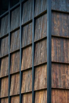 the side of a building with wooden slats on it