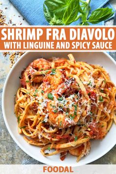 shrimp feta davolo with linguinne and spicy sauce in a white bowl