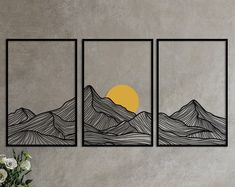 three paintings on a wall with flowers in the foreground and mountains in the background