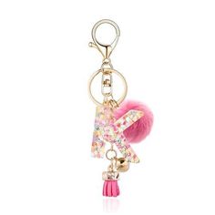 a key chain with a pink pom - pom hanging from it's side