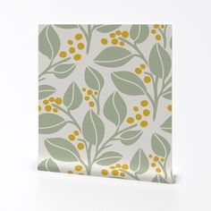 a green and yellow floral pattern on a white wallpaper with gold dots in the center