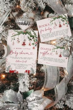 christmas tree decorated with silver ribbon and red and white baby's breather cards