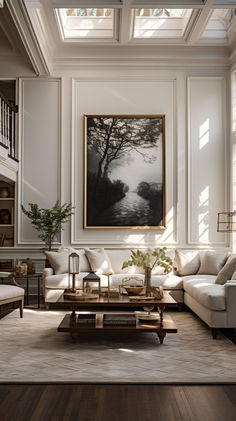 a living room filled with furniture and a painting hanging on the wall above it's fireplace