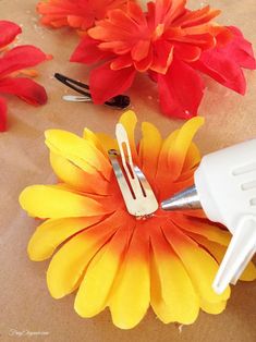 the flowers are being used to make paper flowers