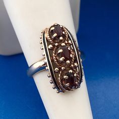 Art Deco Art Nouveau 10K Yellow Gold Oval Garnet January Anniversary Finger Ring Ring size: 6.50 Top of ring measures: 7/8" x 3/8" Garnets measure: approximately 6.0 mm x 3.0 mm each Ring Weight: 4.9 tgw Markings: 10K * AJ   Condition: As pictured, in great condition. G1545 5% Restocking Fee Art Deco Oval Filigree Jewelry, 14k Gold Oval Rings In Art Nouveau Style, Oval 14k Gold Art Nouveau Ring, Vintage Oval Garnet Jewelry, Art Nouveau Oval Gemstone Jewelry, Antique Jewelry Rings, Ring Finger, Vintage Watches, Antique Jewelry