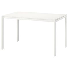 a white table sitting on top of a white floor