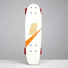 a skateboard with an image of a dog on it's side and orange stripes