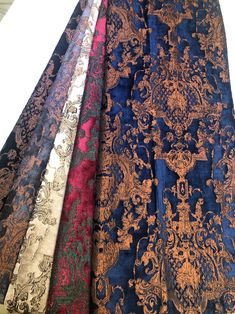 four different colors of brocades are lined up