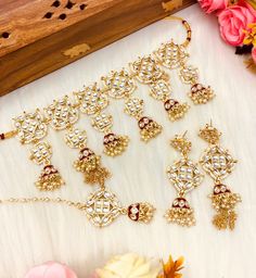 Simple and colorful with beautiful meenakari work! This kundan choker set comes with matching jhumka, tikka and is in gold and multi tones with meenakari work. it is beautifully handmade and is perfect for any party or event!  Gold plating and delicate and dainty colorful bead stones make it a beautiful piece that will look great with any color outfit! This lightweight and elegant necklace is perfect for any bridesmaid, bride, sangeet or any occasion or event as a gift for any occasion as any one who loves jewelry will love this statement piece. It has beautiful colors that really make the set a statement piece. Product Details: * Necklace - Comes with adjustable string * Earrings  * Maang Tikka Free Shipping/Ready to Ship and available immediately if you place an order today! Fast and Fre Kundan Choker Set, String Earrings, Light Jewelry, Kundan Choker, Dainty Choker, Choker Set, Elegant Necklace, Modern Traditional, Pakistani Wedding