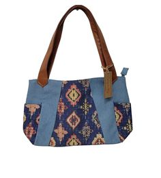 BRAND NEW!! Canyon Sky Southwest Inspiration Southwestern Style Tote Bag. Denim Blue with Aztec printed designs in the center and on outer pockets. Tan faux leather double straps. Purse has two outer pockets, two open inner pockets and one inner zipped pocket. Approximately Measurements: 14.5" Wide 8.5" High 4" Depth 9" Handle drop CANYON SKY Aztec Printed Denim Tote, Blue Multicolor. Denim Tote, Southwestern Style, Printed Denim, Aztec Print, Denim Blue, Blue Denim, Faux Leather, Purse, Tote Bag