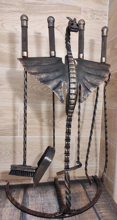 an iron sculpture with chains and knives on it