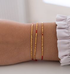 Delicate Silk Bracelet, minimalistic bracelet, wish bracelet, silk friendship bracelet, red string bracelet, simple bracelet, good luck gift by VivienFrankDesigns on Etsy Gold Friendship Bracelets With Tiny Beads As Gift, Friendship Bracelet With Gold Beads, Dainty Red Beaded Bracelets With Tiny Beads, Gold Minimalist Friendship Bracelets With Round Beads, Gold Friendship Bracelets With Gold Beads, Elegant Gold Beaded Friendship Bracelets As Gift, Elegant Gold Beads Friendship Bracelets As Gift, Handmade Minimalist Gold Friendship Bracelets, Dainty Gold Bead Bracelets For Gifts