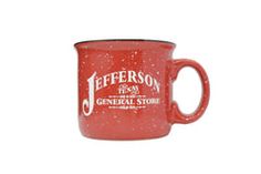 a red coffee mug with the jefferson general store logo on it