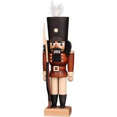 a wooden nutcracker is standing on a white background