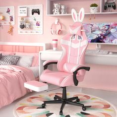 a pink chair sitting in front of a bed