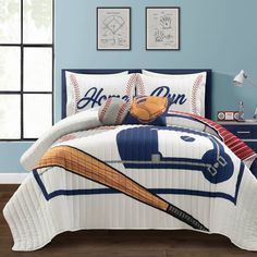 a baseball themed comforter set with a bat and ball