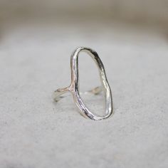 Inspired by the timeless beauty and movement of water, the Lake Ring embodies serenity and the enigmatic depths of the subconscious—a mirror for self-reflection and a gateway to revelation. I meticulously hand-formed the Lake Ring in soft wax, honing its shape while preserving a sense of fluid movement through smooth yet naturally imperfect curves. The result is a piece that feels like liquid on the hand, offering everyday comfort while making a statement through its bold design. Beneath the sil Luxury Hand Cast Modernist Jewelry, Organic Silver Ring, Lake Ring, Organic Shape Jewelry, Ring Casting, Organic Jewelry Design, Silversmith Rings, Silver Smithing, Minimalist Silver Ring