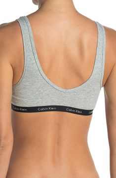 A lightly ribbed fabric creates ultimate comfort on this brand detailed banded bralette. Banded straps V-neck All-over ribbed construction 55% cotton, 35% polyester, 8% elastane Machine wash cold, tumble dry low Imported Ribbed Fitted Bra, Calvin Klein Seamless Spring Bra, Trendy Cotton Bra For Loungewear, Calvin Klein Medium Support Seamless Sports Bra, Calvin Klein Seamless Sports Bra With Medium Support, Calvin Klein Stretch Seamless Sports Bra, Ribbed Fabric, Nordstrom Rack, Bralette