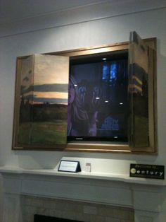 a painting hanging on the wall above a fireplace