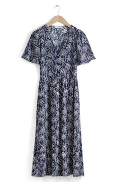 A delightfully dainty floral print enhances the airy style of a V-neck midi dress complete with gently fluttered sleeves. Front button closure V-neck Short sleeves Unlined 100% viscose Dry clean Imported Blue Floral Embroidered V-neck Midi Dress, V-neck Rayon Midi Dress With Floral Print, Rayon V-neck Midi Dress With Floral Print, Non-stretch Floral Print V-neck Midi Dress, Floral Print Viscose V-neck Midi Dress, V Neck Midi Dress, Floral Print Midi Dress, Printed Midi Dress, Nordstrom Dresses