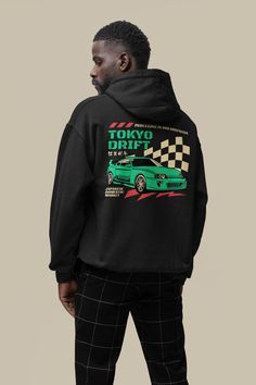 Embark on a stylish journey with our 90s Style Tokyo Drift Hoodie, a fashion statement that captures the essence of retro cool. This relaxed fit hoodie is a nod to the vibrant energy and eclectic style of Tokyo in the '90s. Crafted for comfort and versatility, our Tokyo Drift Hoodie is available in eight different colors, ensuring there's a hue to suit every taste and mood. Made from premium cotton fabric, it offers a soft, breathable feel that's perfect for all-day wear. With its minimalist yet Urban Hoodie With Graphic Print For Urban Adventures, Urban Graphic Print Hoodie For Urban Adventures, Urban Sweatshirt With Back Print For Streetwear, Casual Hoodie With Back Print For Streetwear, Throwback Hoodie With Graphic Print, Throwback Graphic Print Hoodie, Retro Streetwear Hoodie Tops, Retro Hoodie Tops For Streetwear, Urban Sweatshirt With Front And Back Print For Streetwear