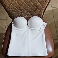 Here Is A Felina Essentials Longline Strapless Push Up Underwire Bridal Bustier Corset Bra Lined Padded White Size 36b 8704 Nwt. It Is New With Tag With The Exception Of A Minor Spot Or Two And A Spot Or Two Inside. The Length From The Armpit To The Hem Is Approximately 13.5 Inches. Stretch Camisole Corset With Built-in Bra, Fitted Strapless Camisole With Removable Bra Pads, White Fitted Tube Top With Built-in Bra, Bra-friendly Fitted Bandeau Camisole, Strapless Seamless Shapewear, Summer White Underwire Corset, Seamless Fitted Underwire Tube Top, Fitted Tube Top With Padded Cups, White Stretch Corset With Medium Bust Support