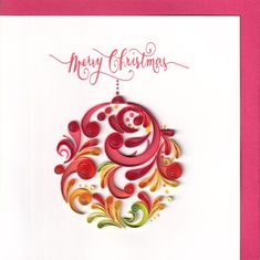 a christmas card with an ornament hanging from it's center and the words merry christmas written in red