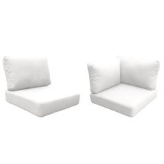 two white chairs with pillows sitting next to each other