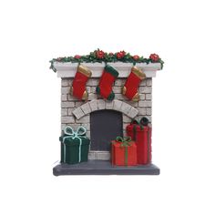 a christmas fireplace with stockings and presents on it