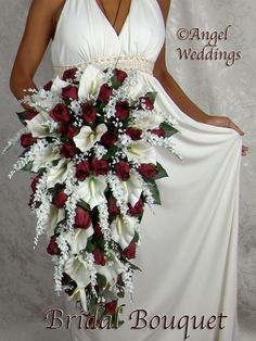 a bridal bouquet with white and red flowers