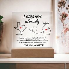 a glass block with the words i love you always on it and a map in the background