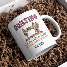 a coffee mug that says quilting it's all fun and games until the grown ones out