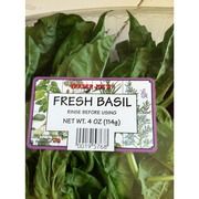 fresh basil growing in the garden with price tag