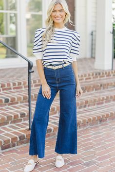 This striped top is so cute and such a perfect way to elevate a basic top. Those puff sleeves are so right on trend and we love the striped print. 
Round neckline
Short puff sleeves
Striped print 
Generous stretch
Baileigh is wearing the small. Blue Puff Sleeve Top, Blue Top Outfit, Mint Julep Boutique, Wardrobe Basics, Model Fits, Puff Sleeve Top, Basic Tops, Inspiration Mode, Navy Stripes