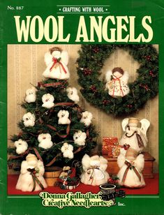 the front cover of wool angels magazine, featuring two snowmen and a christmas tree