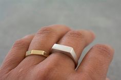 Unisex sterling silver signet ring, designed with a center rectangular outline, perfect for a unique wedding ring. * Rectangular size - 5x13 mm. * Can also be ordered in 18k gold - please contact me for details. * Finish- Matte or Shiny. * Can be made in yellow, white or rose 14k gold. * This price is for a ring in a size up to 9, if you need a bigger size > contact me for price & details. * All jewelry will be sent in a beautiful gift box. * Handmade in my villages studio in northern Isr Minimalist White Gold Open Signet Ring, Modern Sterling Silver Signet Ring Gift, White Sterling Silver Signet Ring Minimalist Style, Minimalist White Sterling Silver Signet Ring, Modern Sterling Silver Open Signet Ring, Modern Silver Signet Ring For Everyday Wear, White Open Signet Ring For Everyday Wear, Modern White Open Signet Ring, White Sterling Silver Signet Ring With Open Shape