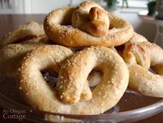 a pile of pretzels sitting on top of a glass plate