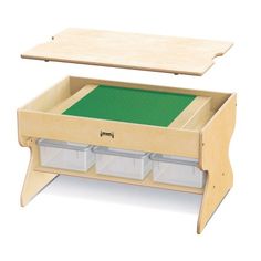 a wooden desk with two drawers and a green surface on the bottom shelf, in front of a white background