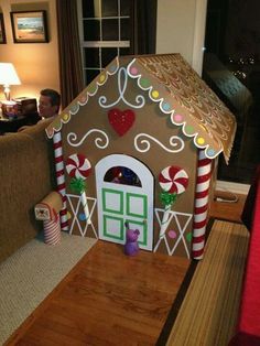 a gingerbread house with candy canes on the outside