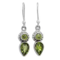 Over three carats of teardrop and circular peridot stones with beautiful green hues adorn this pair of Indian dangle earrings handcrafted from sterling silver by local artisans. Shanker proudly presents his own designs in these wonderful earrings. Green Peridot Teardrop Earrings, Peridot Teardrop Earrings For May Birthstone, Teardrop Peridot Earrings For May Birthstone, Peridot Dangle Earrings, Rough Gemstone Ring, Handmade Silver Earrings, Raw Opal Ring, Peridot Jewelry, Peridot Earrings