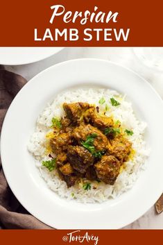 a white plate topped with rice and meat