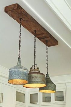 three light fixtures hanging from the ceiling