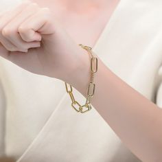 Classy 14K Gold Plated Paperclip Chain Bracelet. This bracelet features a sophisticated design fashioned from two types of paperclip chains: one made out of solid metal and the other one with wavy texture, changing alternately. Crafted with 14K Gold Plating and it is secured with spring lock closure. Paperclip Bracelet, Trending Bracelets, Multi Strand Bracelet, Strand Bracelet, Stud Earrings Set, Sophisticated Design, Solid Metal, Paper Clip, Bracelet Sizes