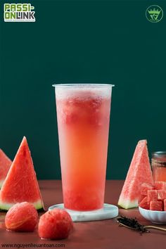 watermelon juice in a glass next to slices of watermelon