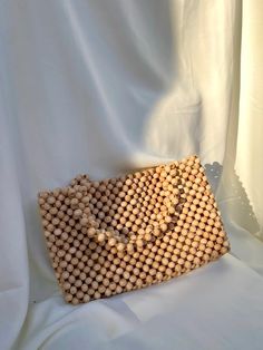 It is made to order. It is a summery, bohemian, useful and stylish bag. It is made of wooden beads. You can send me a message for more details. Bead Bag, Beaded Bags, Stylish Bag, Clutch Handbag, Wooden Beads, Crochet Bag, Evening Bags, Purses And Handbags, Clutches